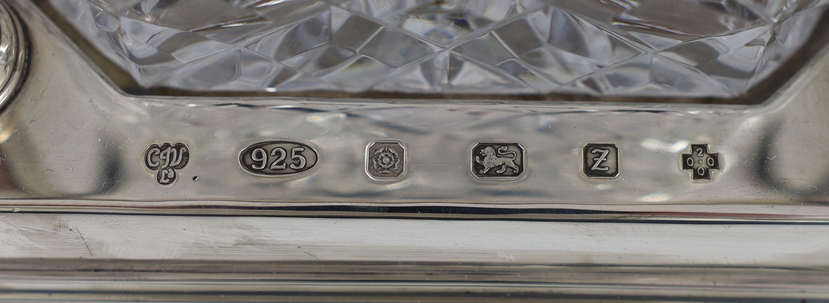 A modern silver three bottle rectangular decanter stand, by C.J. Vander Ltd